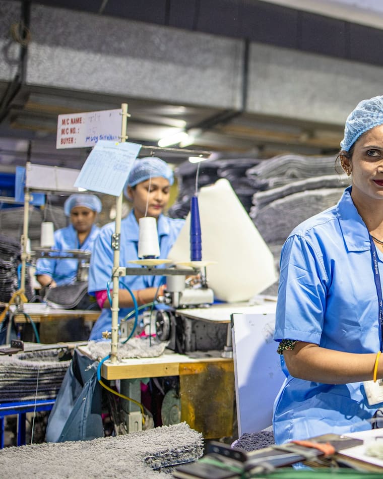 A factory operator at her machine