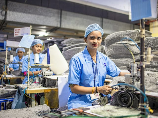 A factory operator at her machine
