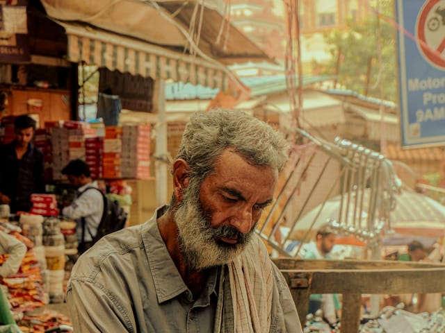 A trader at his market counter