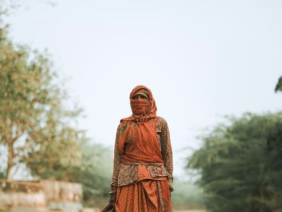 A woman on a rural road in Rajasthan